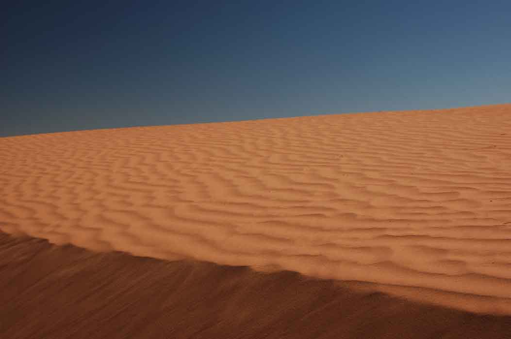 Sand dune in the high desert near the Navajo community of Kaibito , Arizona