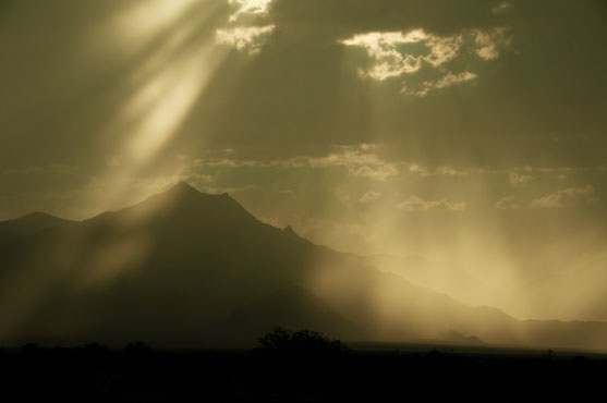 Sun and clouds over the Estrella Mts. on the outskirts of Phoenix, Arizona
