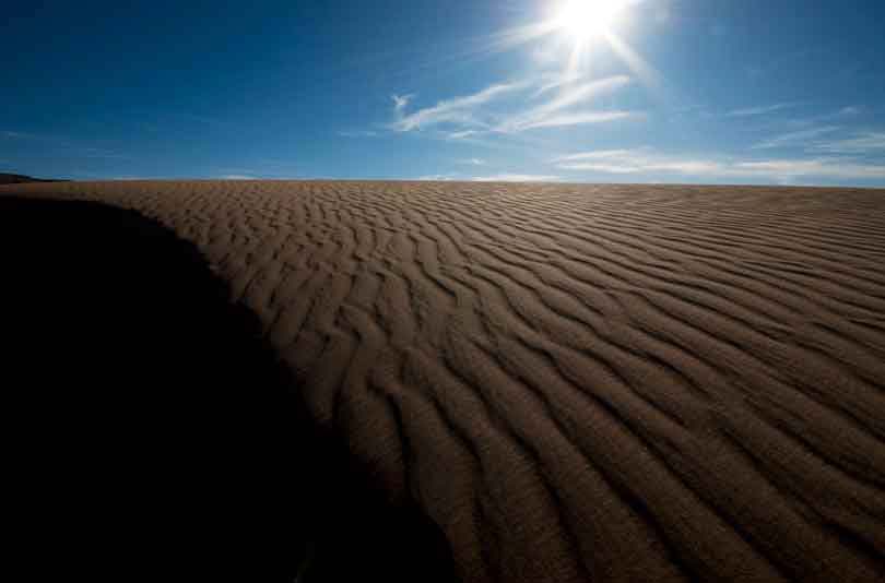 Sand dune in the high desert just north of the Little Colorado River on the Navajo Reservation, Arizona