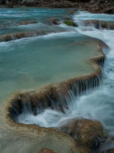 Travertines in the blue water of the Little Colorado River, at the bottom of the Little Colorado Gorge at Salt Canyon