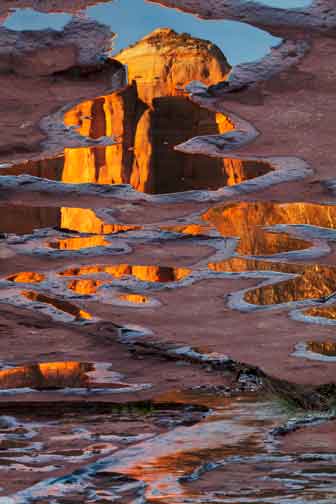Cathedral Rock reflecting in puddles along Oak Creek, Arizona