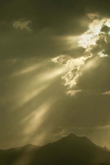 Sun and storm clouds in the Estrella Mts. southwest of Phoenix, Arizona