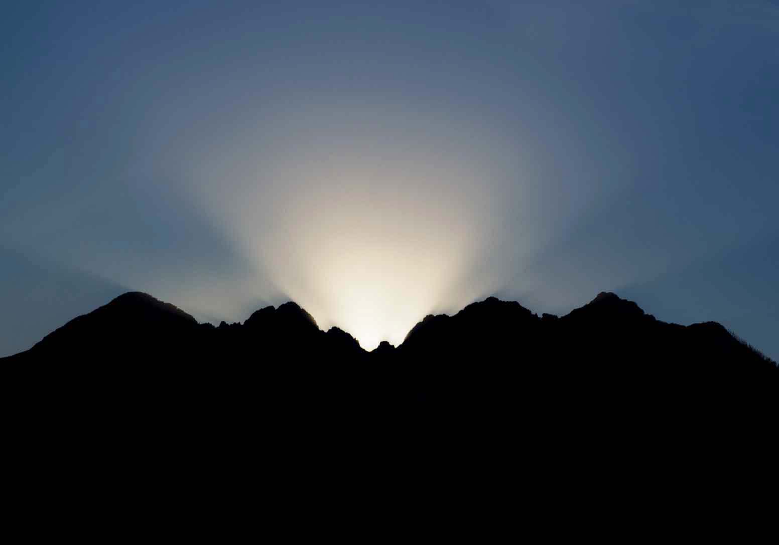 The sun sets behind Four Peaks in the Mazatzal Mts. of Arizona, as seen from near Roosevelt Lake (looking west)
